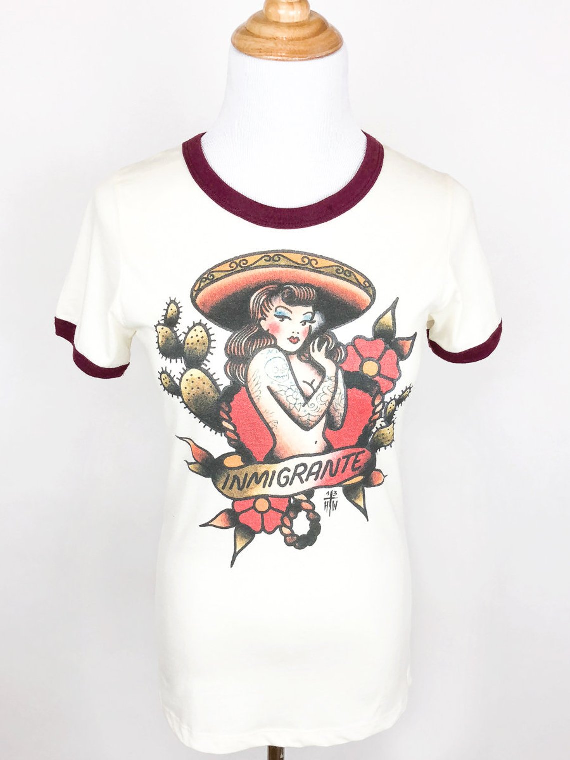 Inmigrante Ringer T-shirt in Natural/Maroon design by Howlin' Wolf Tattoo